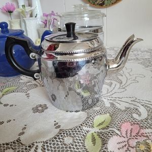 Elegant Silver Teapot with Black Handle